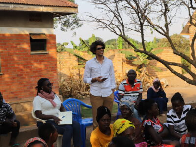 Muhammad partaking in a rural community discussion about gender equality in Luwero County, Uganda.